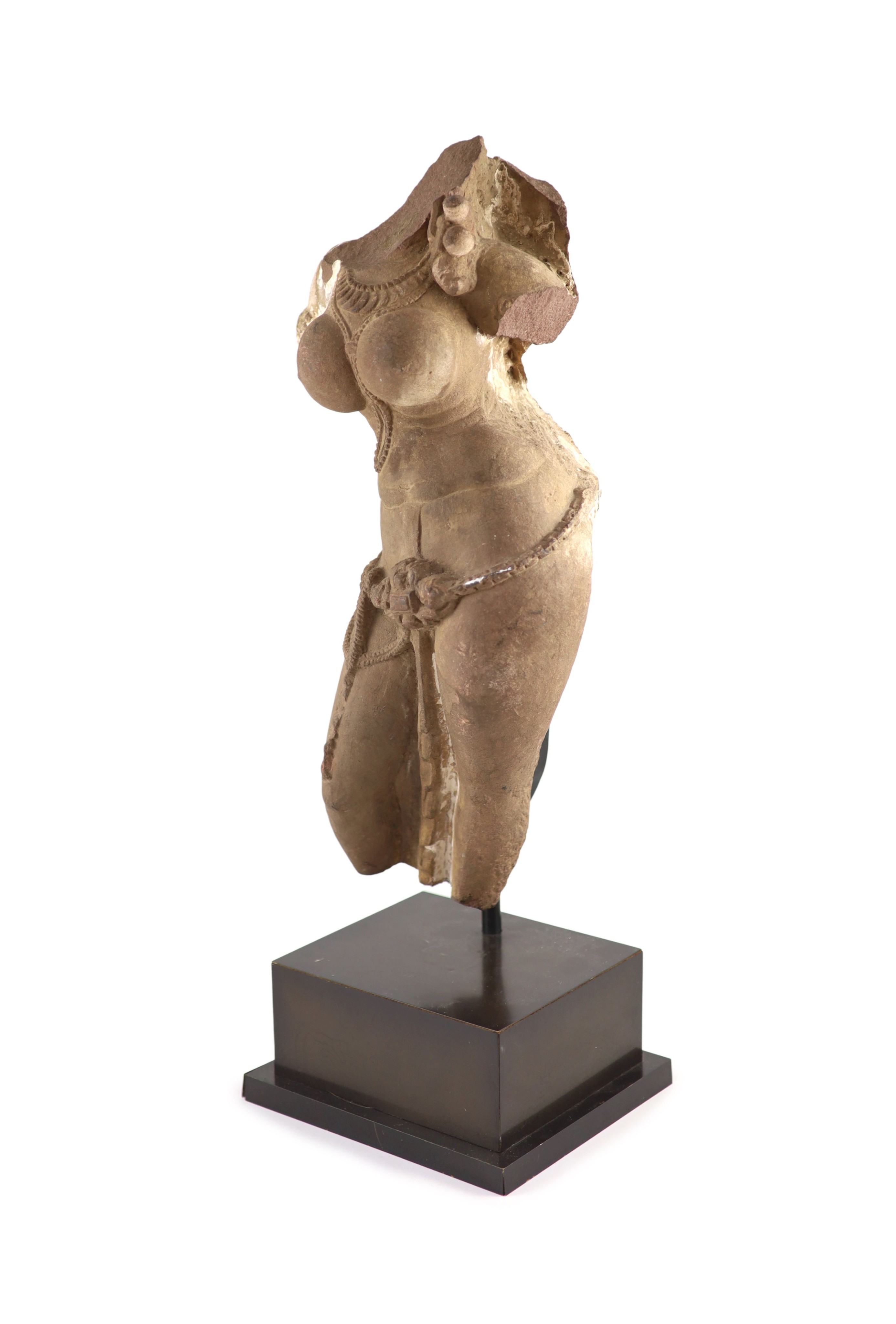 A Central Indian red sandstone torso of a Goddess, Madhya Pradesh, 10th/11th century, Total height including later metal stand 61 cm